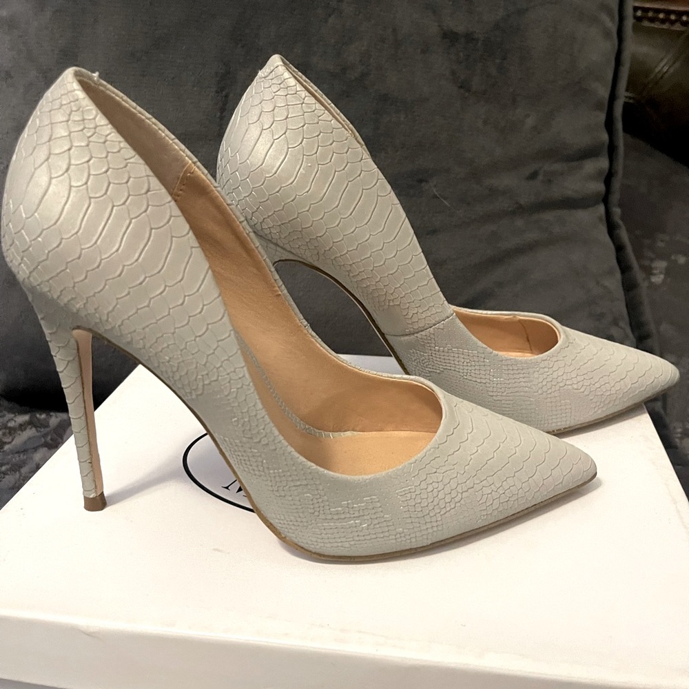 Almost new, used twice. Gray stilettos, iridescent in certain lighting.